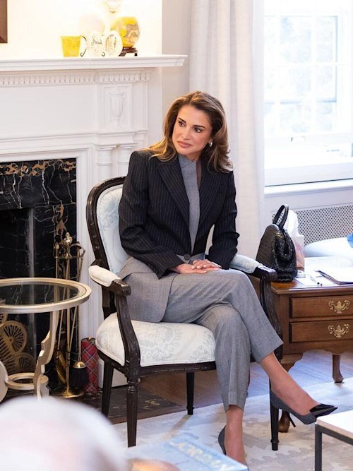 Queen Rania wears an Alexander McQueen suit to sit in on a business meeting in the USA